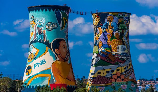 Painted cooling towers (largest mural in South Africa) of decommissioned Orlando Power Station, now a 300 meter bungee jump, Orlando Towers, Soweto, Johannesburg, South Africa.